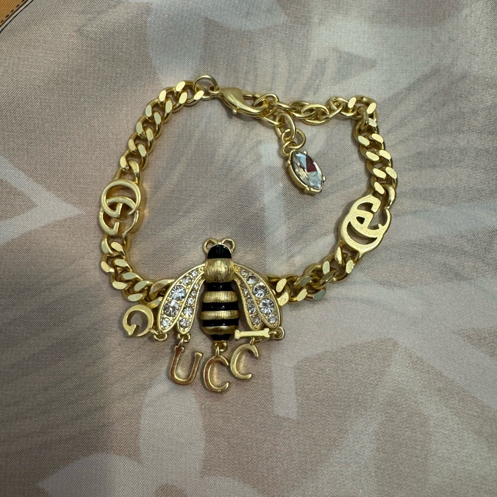 Gucci Gold-Tone Bee Charm Bracelet with Black Enamel and Crystals